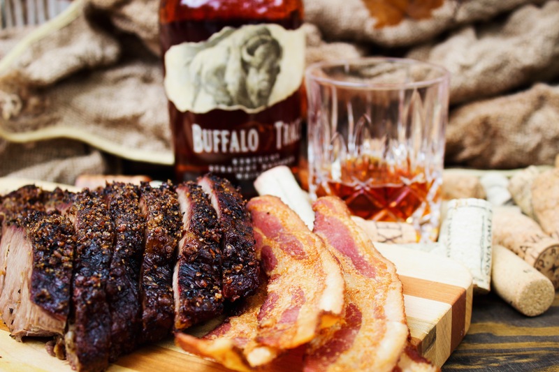 A bottle of Buffalo Trace whisky with bacon and barbecue